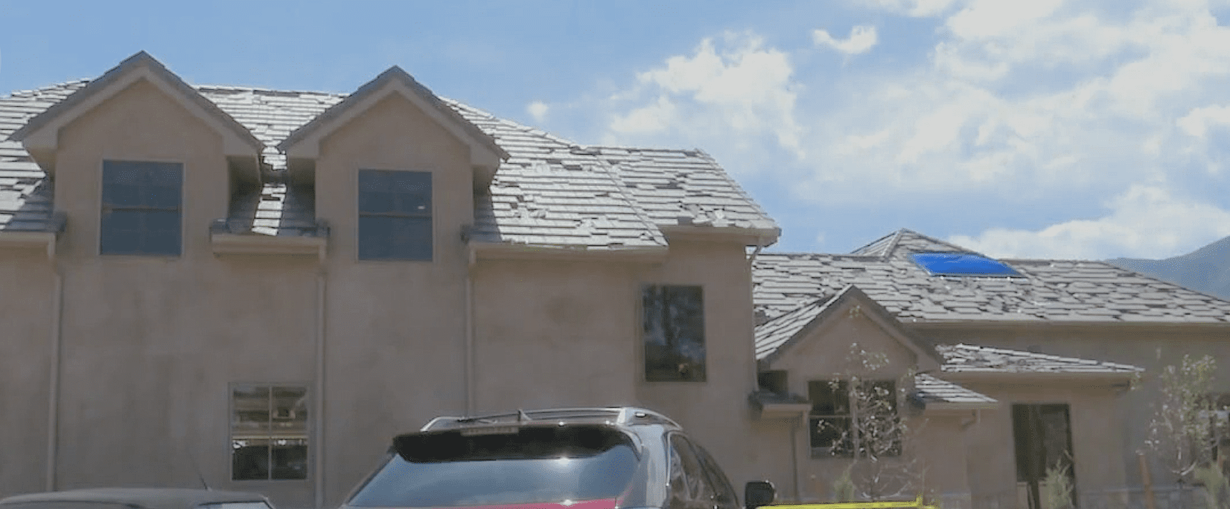 A car parked in front of a house.