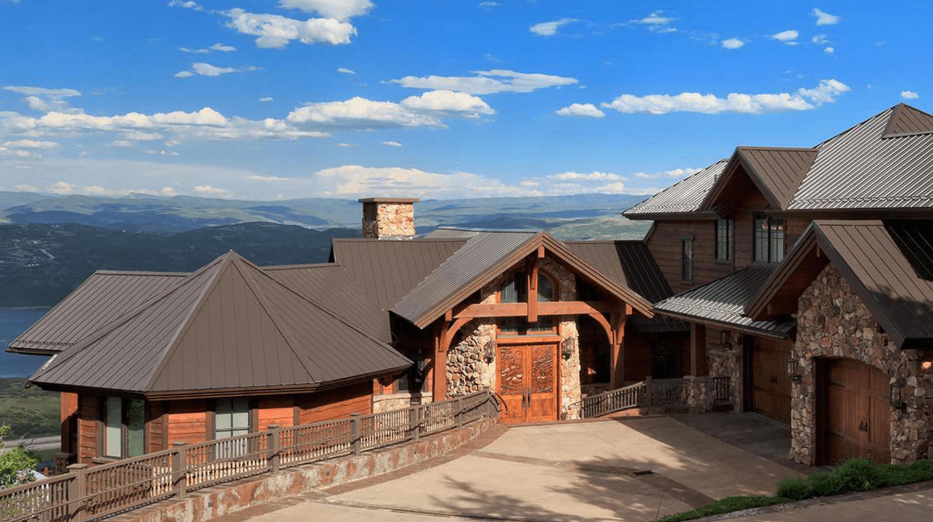 A large house with a fence and a sky background