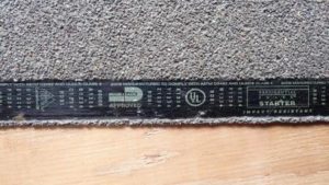 Carpet edge with tack strip underneath.