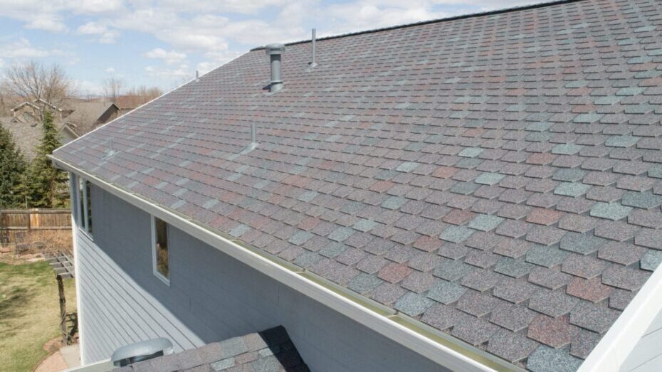 House with a shingled roof exterior view.