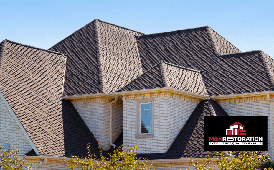 House with complex roof design and logo.