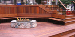 A fire pit sitting on top of a wooden deck.